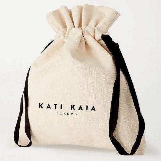 Kati Kaia Black Obsidian Crystal Necklace in a natural canvas pouch with drawstring closure