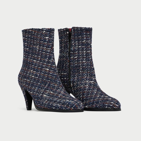 Pair of Maya tweed ankle boots on a light gray background