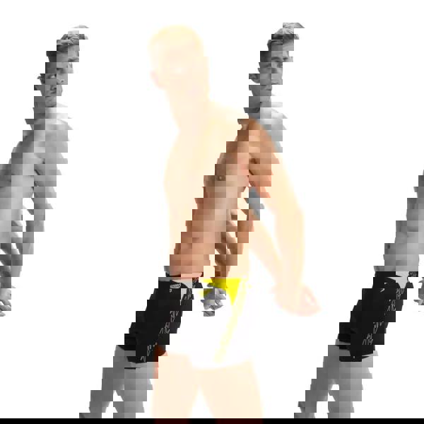 Sleek black and yellow Speedo Hyperboom Splice Aquashort swim trunks