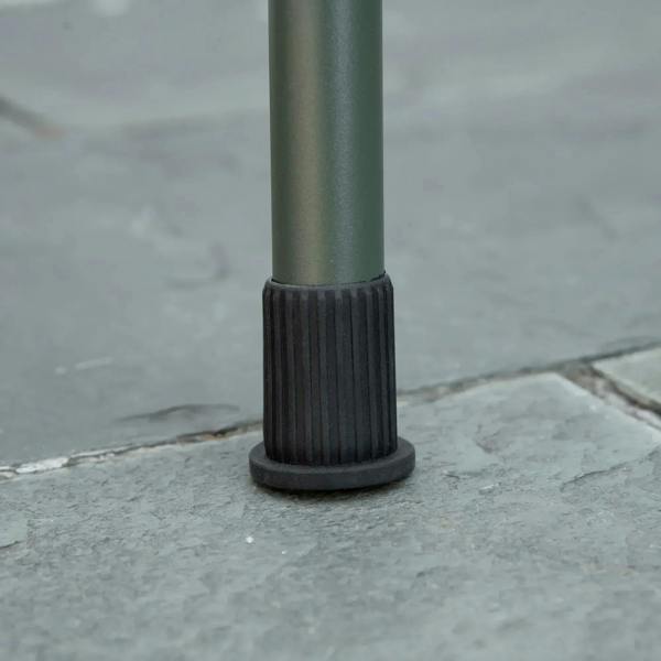 Green BBQ grill leg with black rubber foot cap for stable, non-slip footing