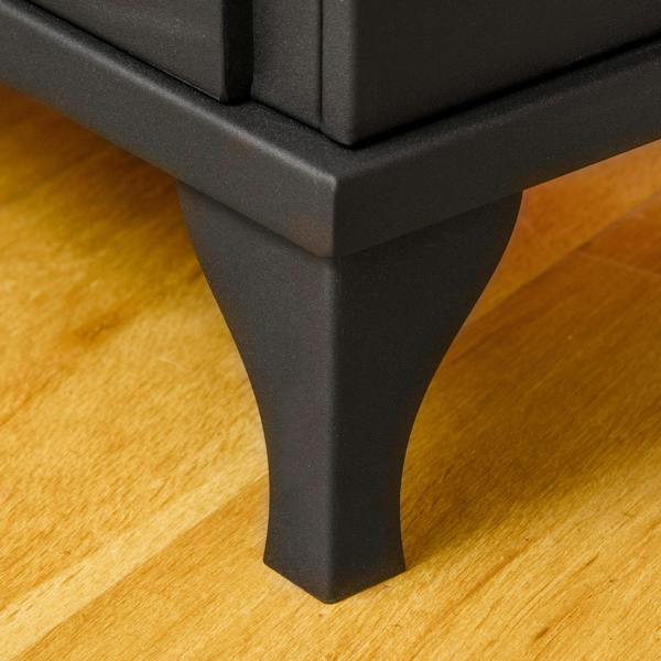 Black ethanol fireplace stove leg and base corner on a wooden floor