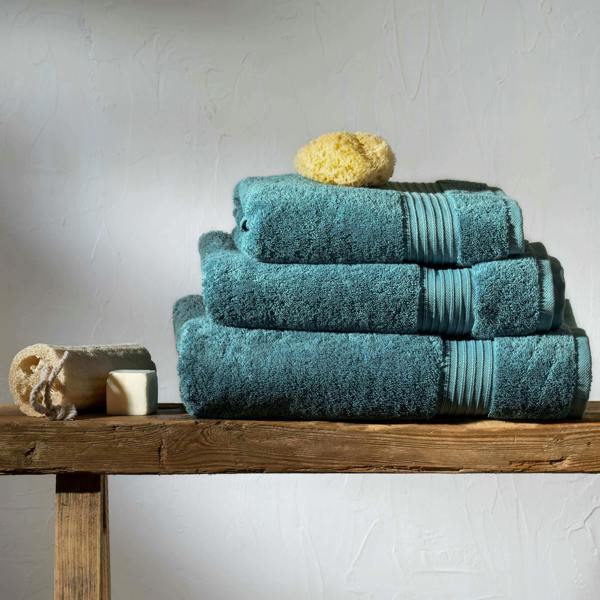 Teal Egyptian Cotton Bath Sheet styled in a bedroom | Soak and Sleep