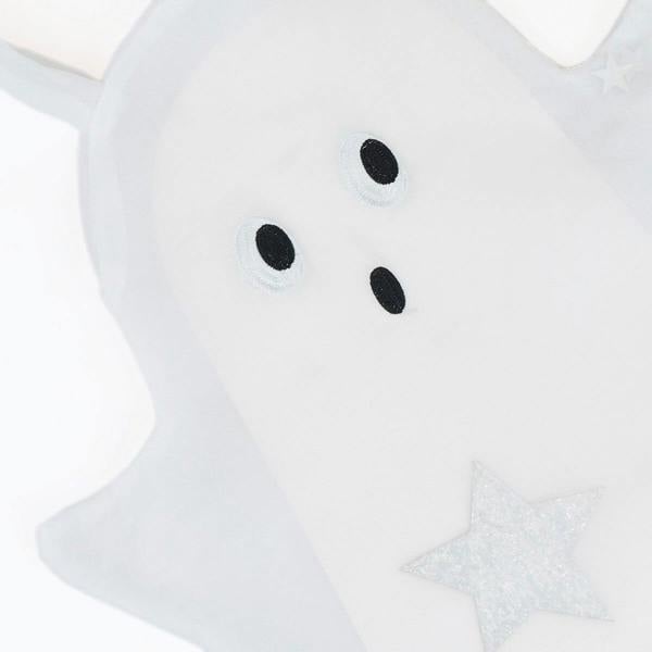 Close-up of black embroidered eyes and mouth on white organza ghost bag with a silver glitter star