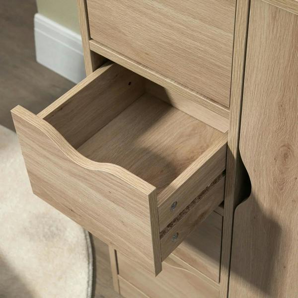 Light wood cabinet drawer partially open with interior storage space