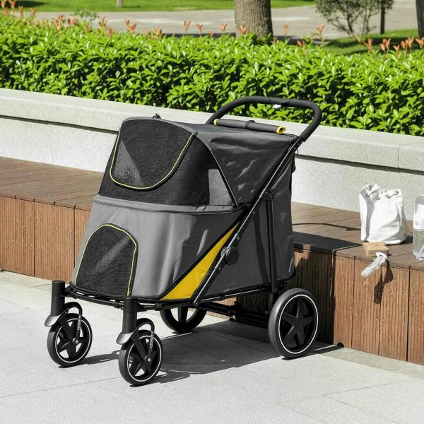 Foldable pet stroller, dark grey with yellow trim and mesh canopy on patio