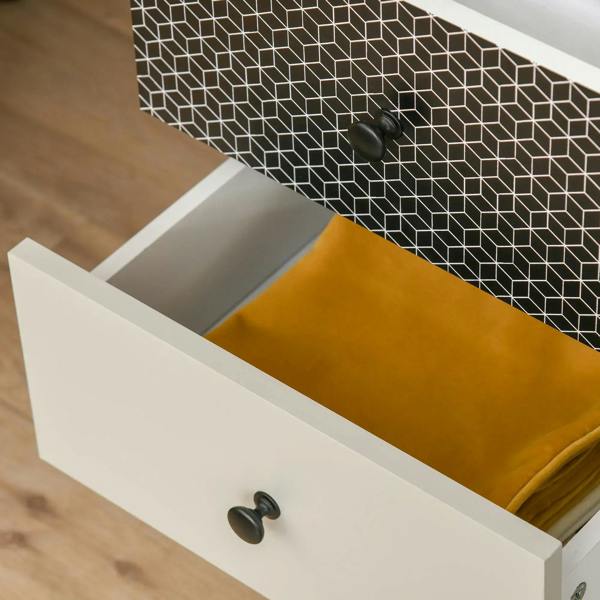 Cream drawer with round knob and geometric patterned side panel in black and white