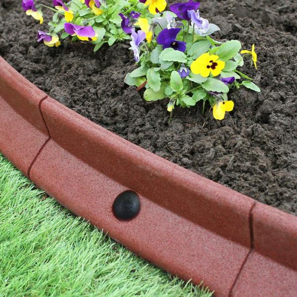 Flexible terracotta lawn edging, 1.2m long, featuring a smooth texture and curved design, enhancing garden flower beds with vibrant pansies