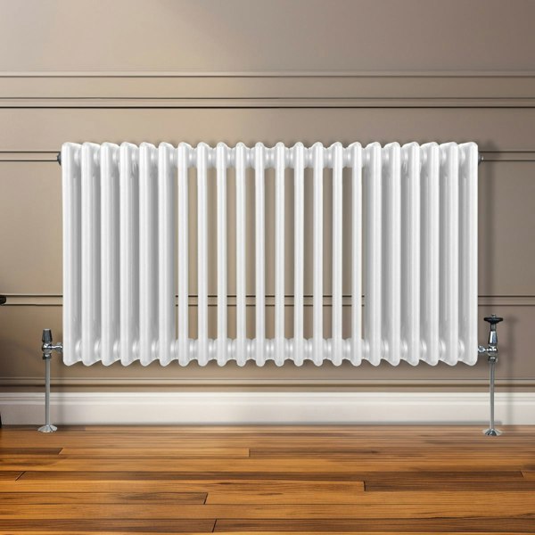 Traditional 3 column radiator in white, featuring a sleek, ribbed design, mounted on a wooden floor against a neutral wall
