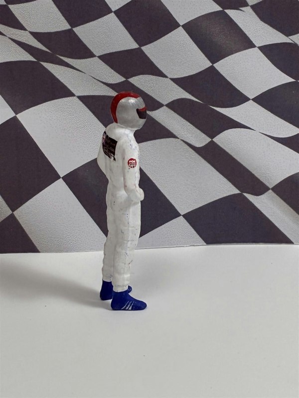 a toy astronaut in a helmet