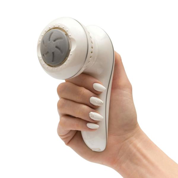 hand holding 60 second spa pedi with sanding head rotating 