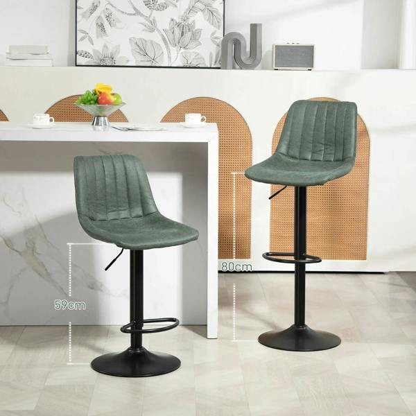 Set of two green retro bar stools, tufted high backs, black pedestal bases, and footrests