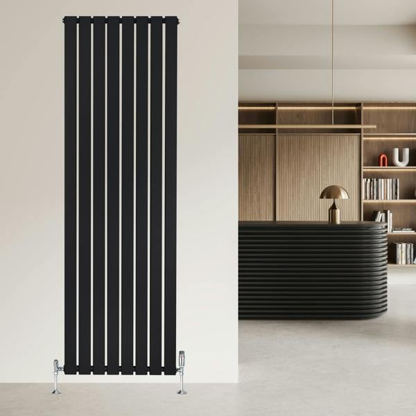 Flat single column radiator in sleek black finish, measuring 1800 x 560mm, mounted on a modern wall in a stylish interior setting