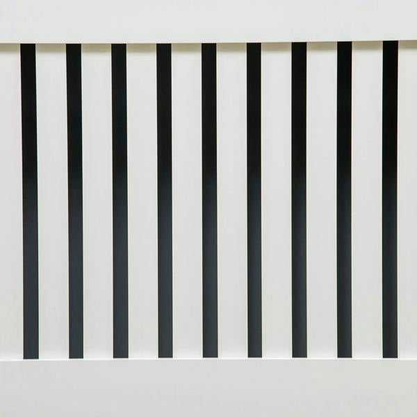 Close-up of white vertical slats on the radiator cover front grill.