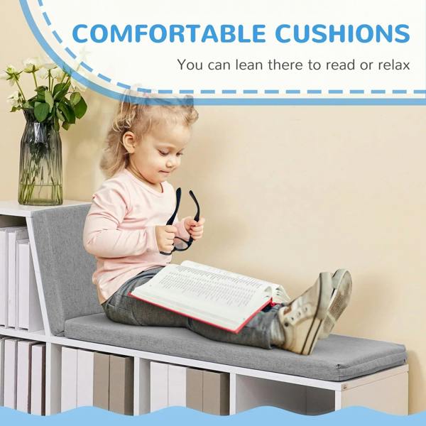 White bookcase storage shelf with gray cushioned reading seat and open storage cubbies