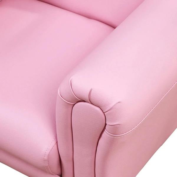 Pink upholstered armrest with stitched seam detail on kids sofa chair.