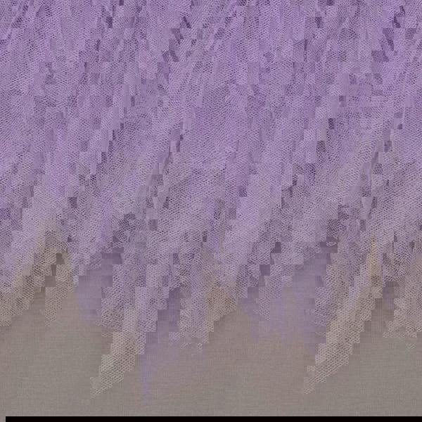 Close-up of a purple tulle skirt on a plain background