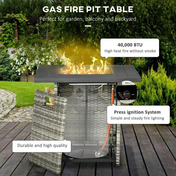 Grey rattan gas fire pit table with open lid, flames, and propane control regulator