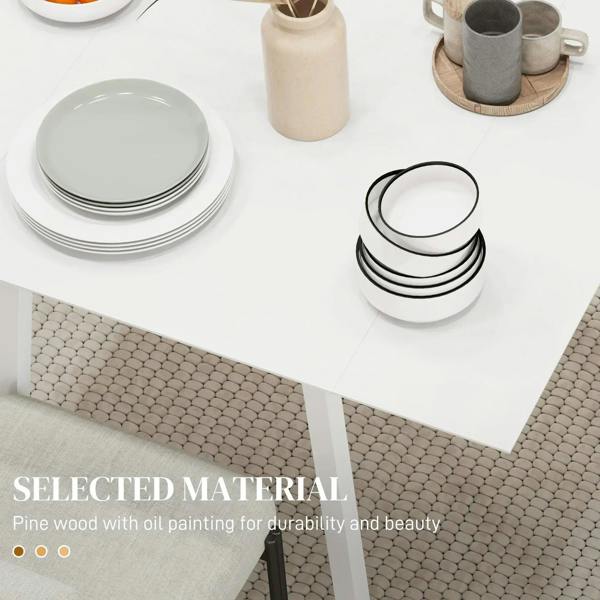 White tabletop corner of solid wood folding table with stacked plates and cups