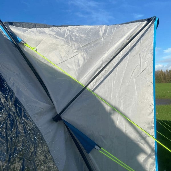 A side view of the protective peak canopy on the OLPRO Cocoon V2 Poled Campervan Awning