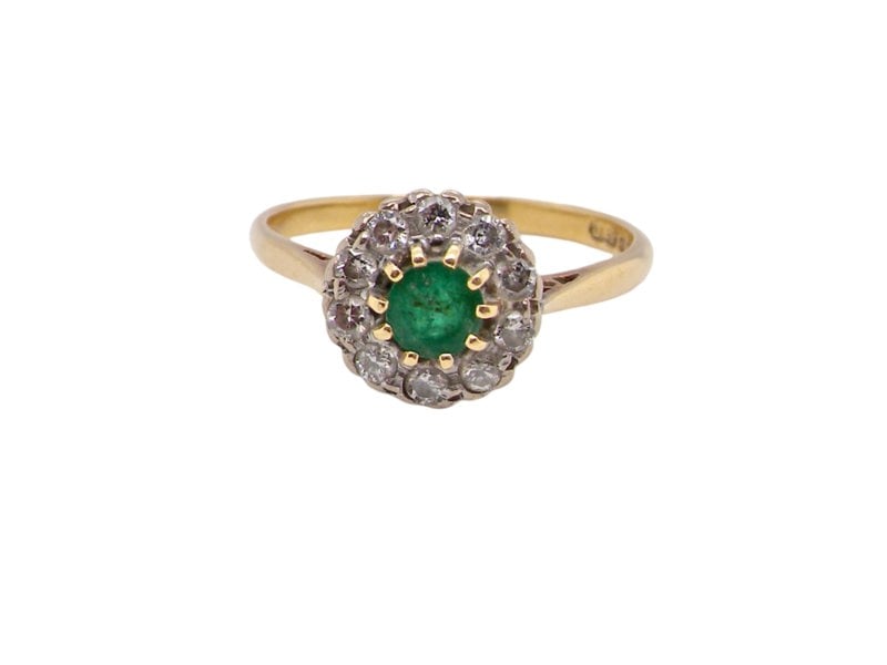 A vintage Emerald and Diamond cluster ring