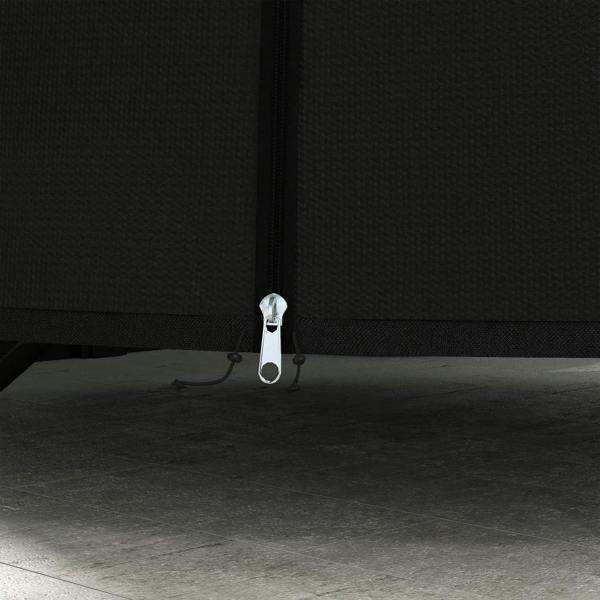 Close-up of black bottom zipper pull on egg chair protective cover