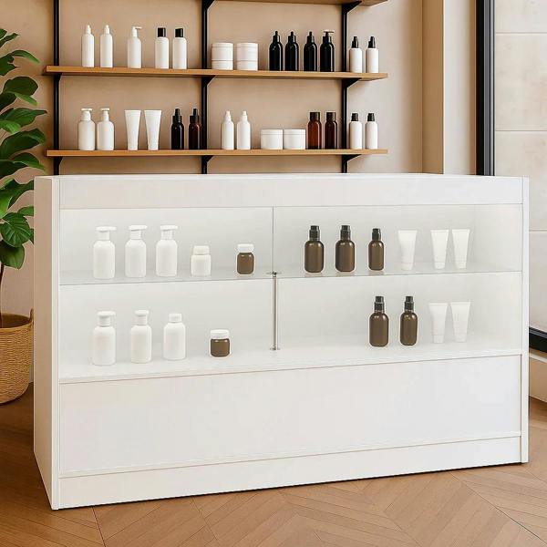 LED retail shop counter C1500 in white, featuring glass display shelves showcasing various skincare products and a modern design