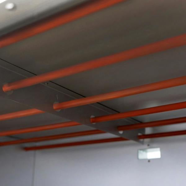 Interior view of the KuKoo large commercial pizza oven showcasing metal racks with orange supports for optimal baking space
