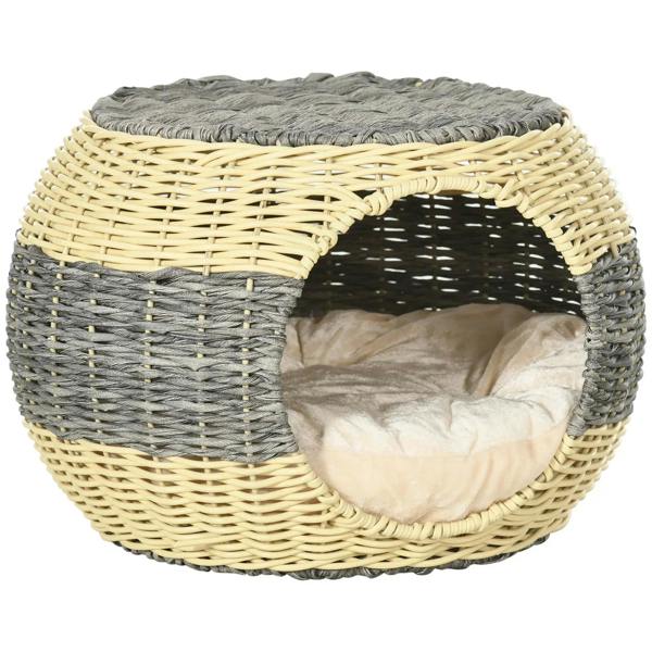 Front view of round wicker cat house with two-tone weave and beige cushion.