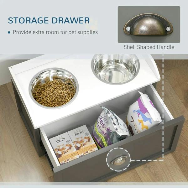 Grey raised dog feeding station with open storage drawer holding pet food; two stainless bowls.