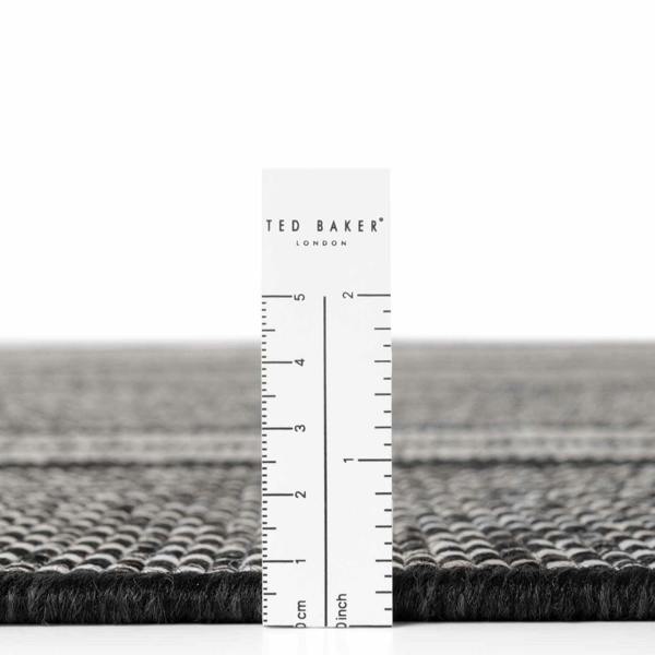 Ted Baker London rug with a ruler for scale on a white background