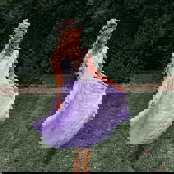 young girl wearing lilac flower girl dress