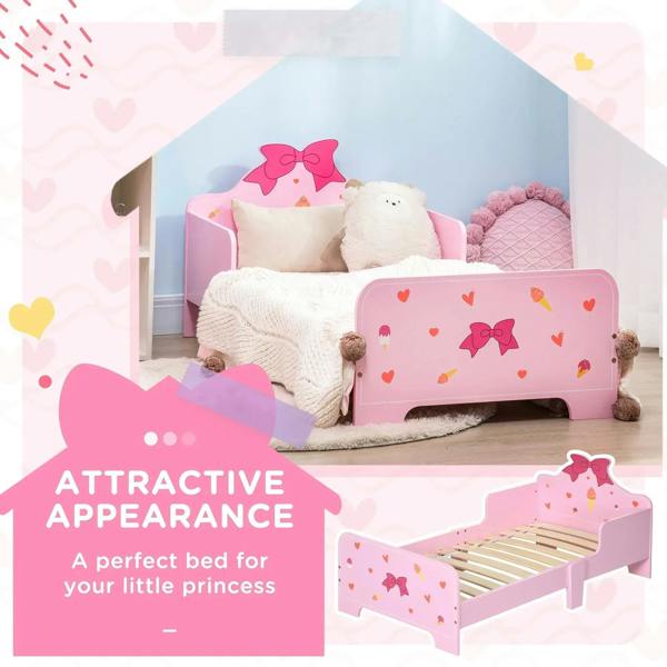 Pink toddler bed with princess bow headboard and heart-pattern side rails, enclosed low profile