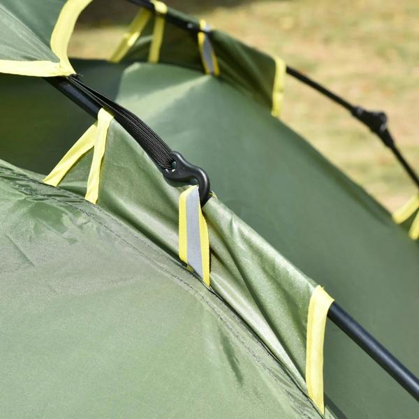 Green tent fabric with black-and-yellow strap and snap buckle close-up