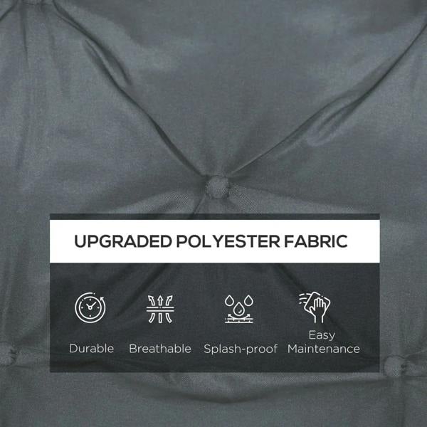 Dark grey quilted polyester cushion fabric close-up with stitched tufts