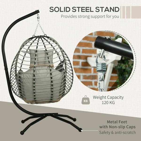 Grey hanging egg chair with padded cushions, black metal stand, and hanging chain