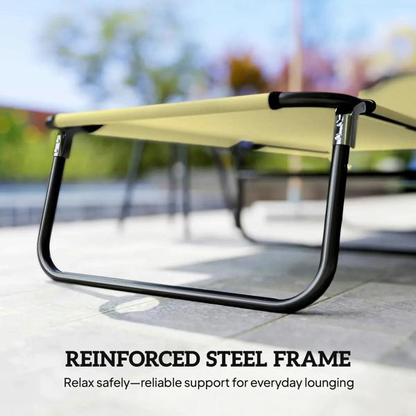 Beige foldable sun lounger with black steel frame on patio surface