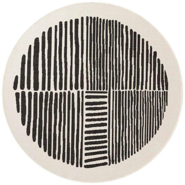 Round rug with black line pattern on a beige background