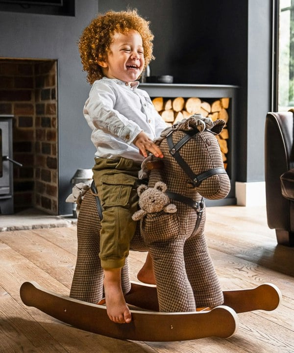 Toddler boy rocking on Chester and Fred rocking horse for 1 year old