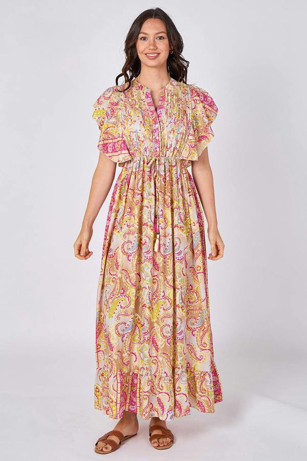 Woman wearing a colorful patterned dress on a white background