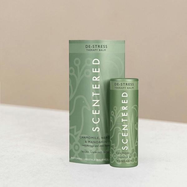 Scentered de-stress therapy balm and packaging on display.