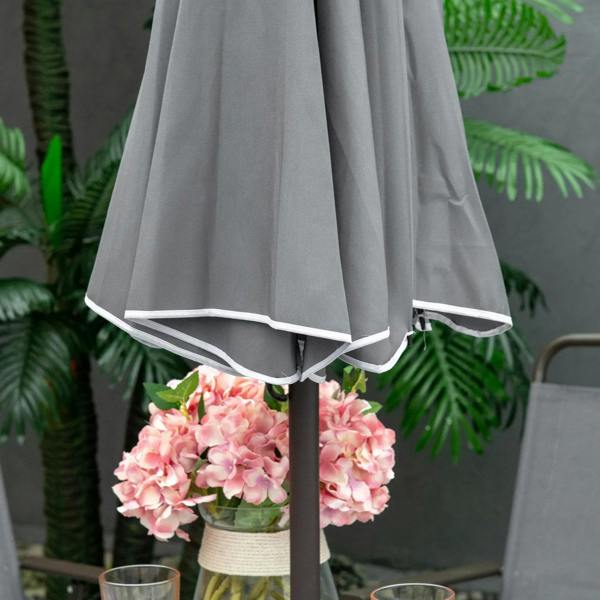 Grey umbrella canopy edge with draped fabric and central pole