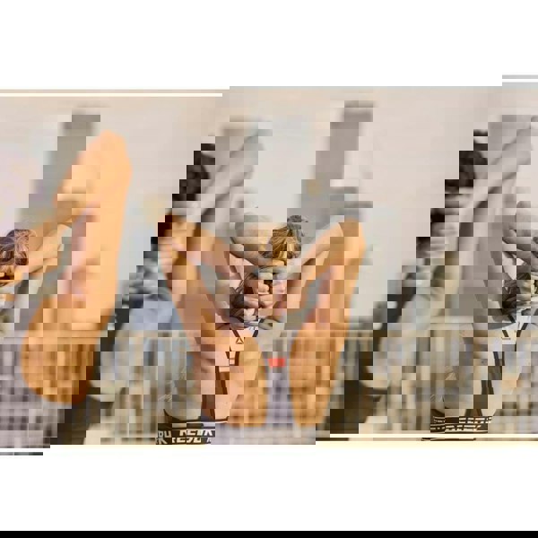 Two women exercising using Reebok 1kg Dumbbells