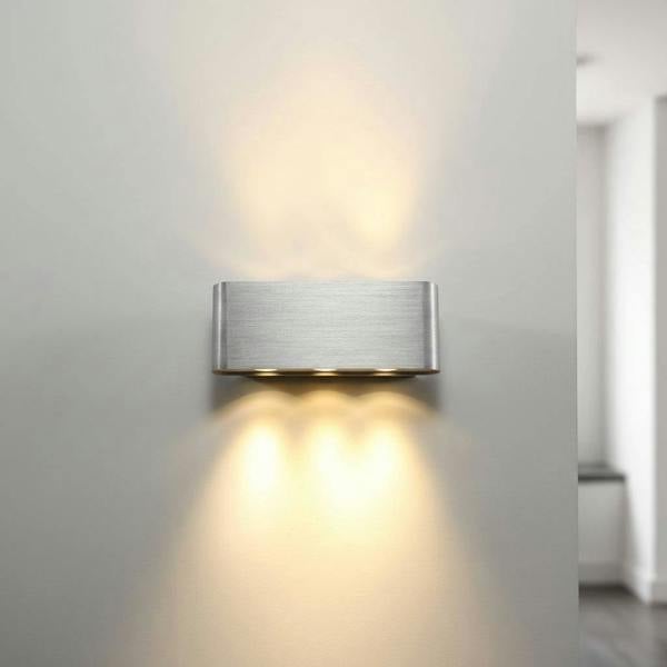 Silver internal wall light up and down showing the three lights illuminating the grey wall