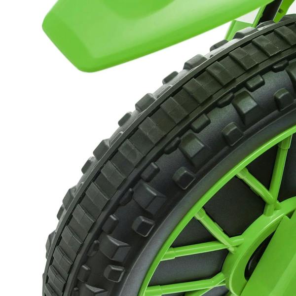 Close-up of green front wheel and black tire tread on a kids electric ride-on motorcycle