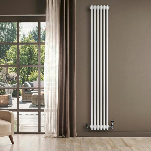 Tall, traditional white 4 column radiator against a neutral wall, featuring sleek lines and elegant valves, enhancing modern decor