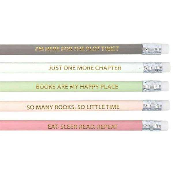 Close-up of five literature-inspired pencils showing book quote text on pastel barrels