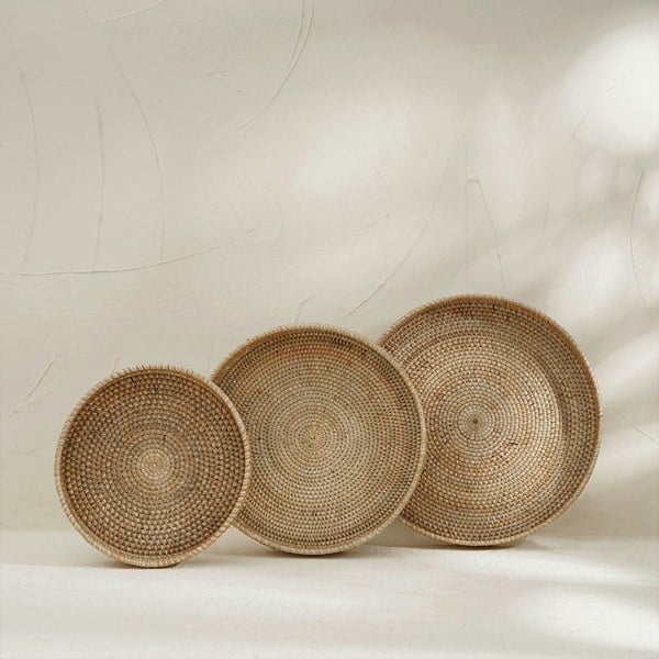 Three natural wicker trays in three sizes 