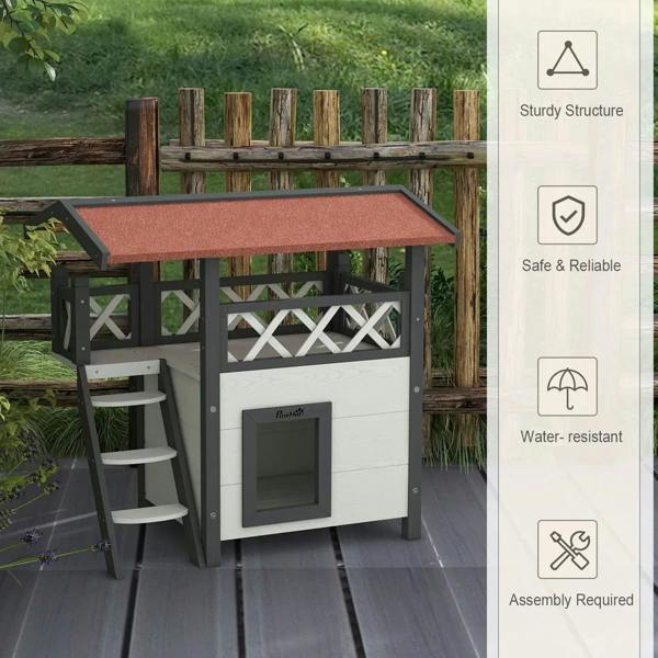 White outdoor cat house with balcony roof and side ladder, front cat entrance