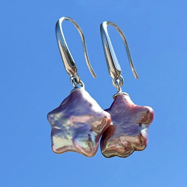 Star-shaped baroque pearl earrings, handcrafted featuring rare celestial pearls.