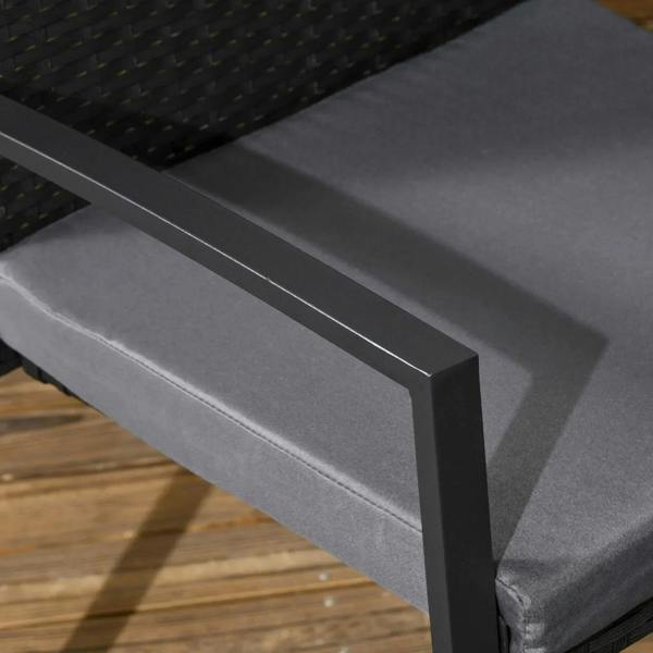 Black rattan chair armrest with thick gray cushion pad